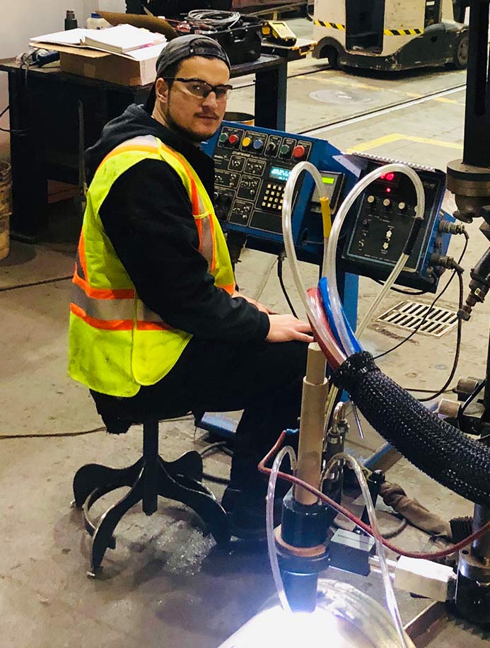Photo showing an Altech technician during HMI troubleshooting and repair