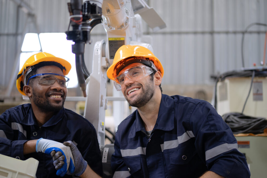 factory workers operating equipment safely after Altech Process retrofit installation